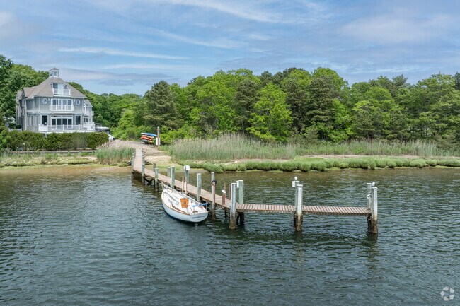 Waterfront homes on the bays of Marstons Mills often feature private docks for their boats.