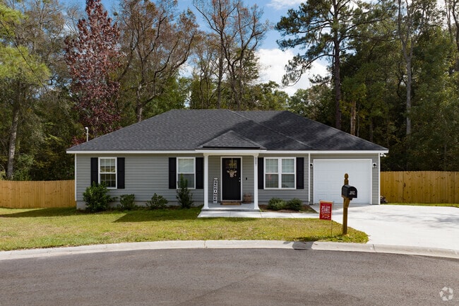 Compact homes in Springfield with vinyl siding feature one car attached garages.