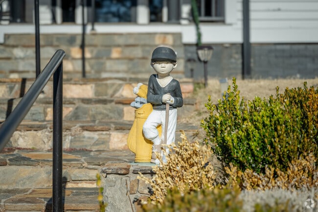 A charming black-and-white golf figurine adds character to The Rock Golf Club in Holly Springs.