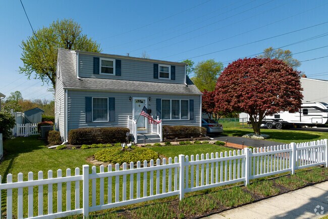 Yardville features charming Cape Cod homes with white picket fences.