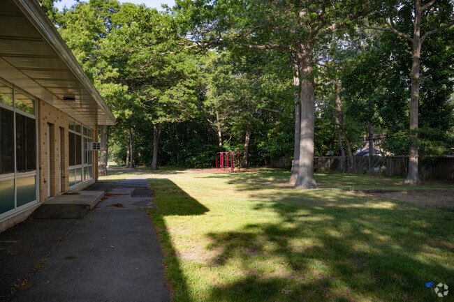 Lovely green space with a swing set in the back at Nokomis School.