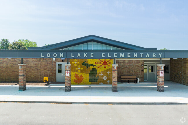 Loon Lake Elementary School in Wixom main entrance with a mosaic tile artwork wall.