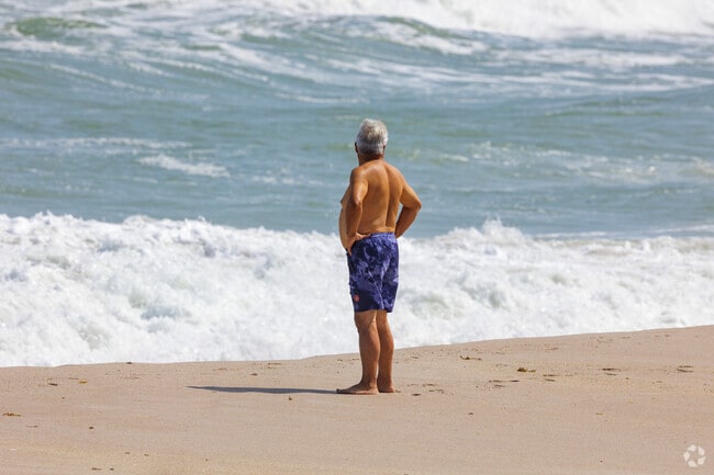 Residents of Paradise Beach enjoy the sand and waves at Paradise Beach & Park.