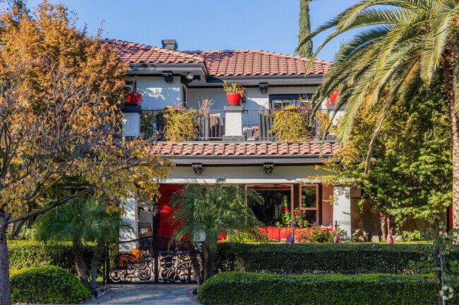 A Spanish revival home with a lush front yard in Aurora.