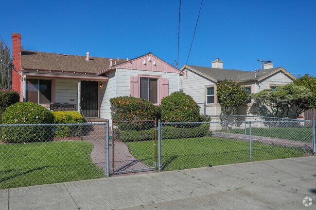 Many of the homes in the Webster neighborhood are fenced in with landscaped walkways.