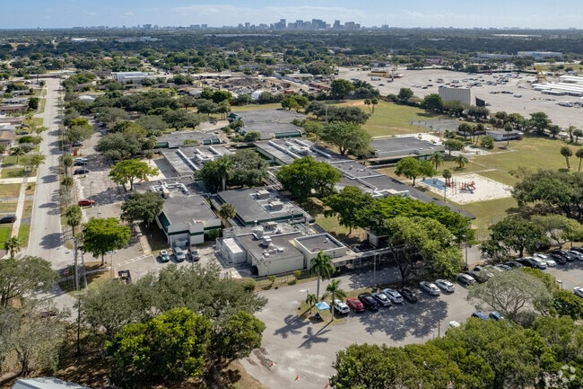 Bird's eye view of Larkdale Elementary School in Ft Lauderdale, FL overlooks the skyline.