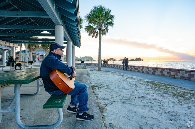 Guests of Robert J. Strickland Memorial Park enjoying the acoustic music.