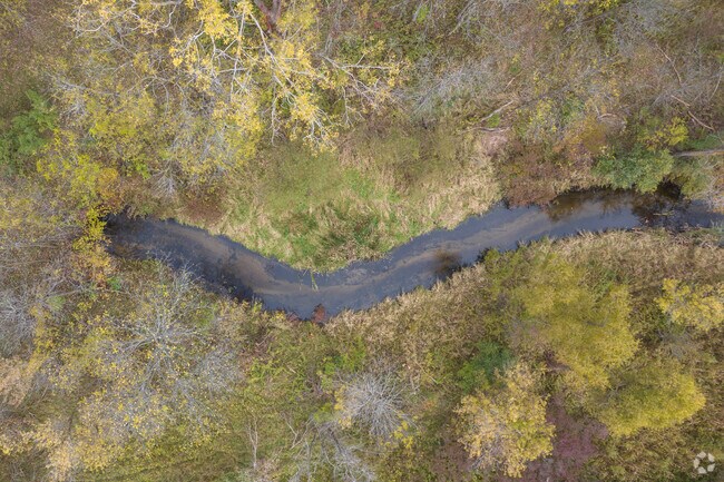 Lazy creeks wind through Grattan Township’s lush, wooded countryside.