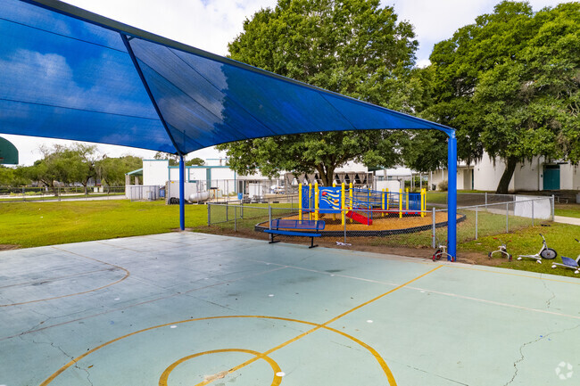 Colson Elementary School has a partially shaded basketball court for students.