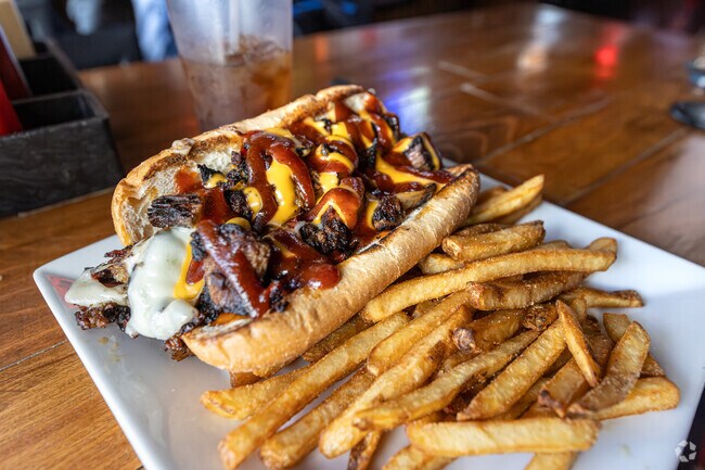 Checkered Flag Tavern in Ameriplex has award winning food including their Brisket filled Philly.
