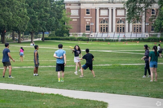 Students take a break and enjoy playing frisbee in
the U of I Quad area.