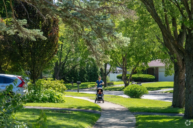 A road in Scots Plains gently curves for a more scenic walk for a mom and her baby.