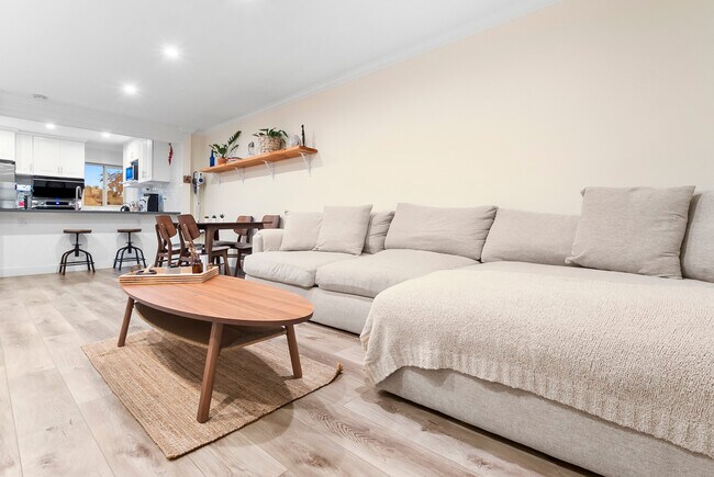 Welcome to a Bright and Airy Oasis! Enjoy the Open-Concept Living and Dining Room.