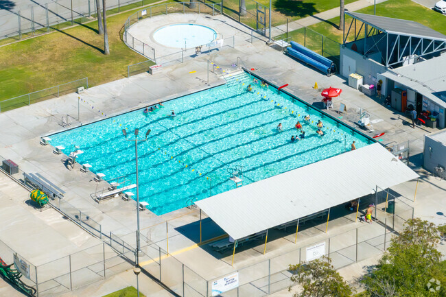 Residents of Magnolia Center enjoying the community pool at Shamel Park.