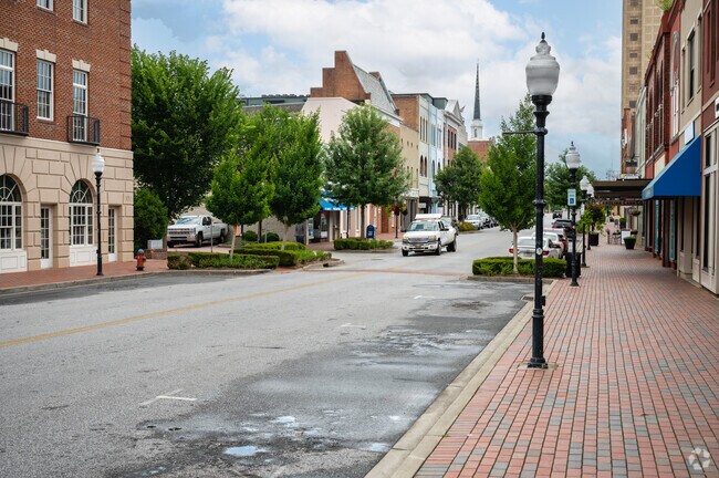 The streetscape of the Main Street in Spartanburg has rustic style architecture.