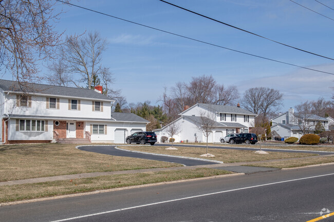 Many homes in the Gordons Corner neighborhood are on gently sloped lots that give great access.