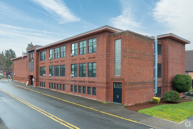 St John the Apostle Catholic School is characterized by its classic brick facade on 5th St.