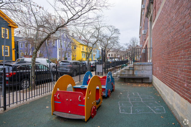 There's a play area for young ones on the right side of Tobin Montessori in Mid-Cambridge.
