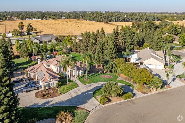 Large custom built homes sit against the backdrop of quiet farmland in McSwain.