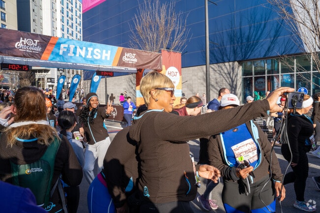 Runners celebrate their accomplishments by snapping a photo at the finish line of the Atlanta Hot Chocolate Run.