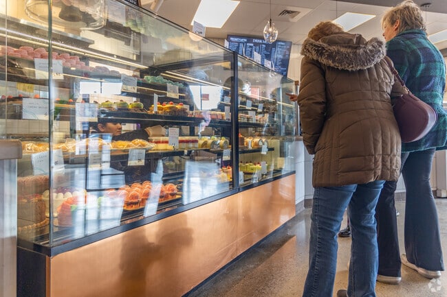 Chef Ava checks on the pastries on display at White Wolf in Clawson.