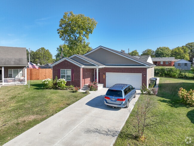 A Bryan Station brick ranch with maroon shutters