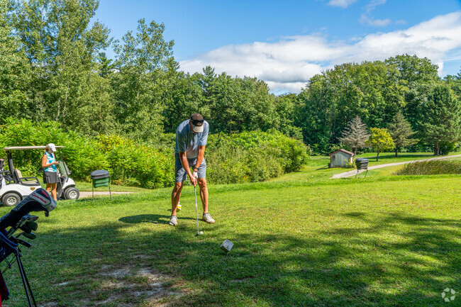 A golfer lines up their golf ball at Claremont Country Club near South End.