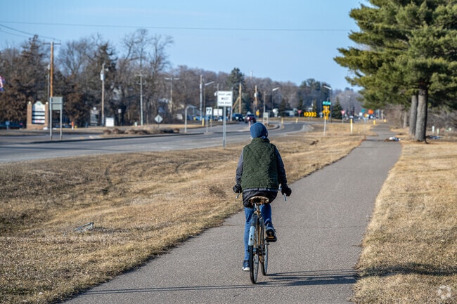 Lakeland residents utilize the bike trail along St. Coix Trail to get around town.