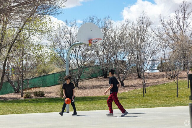 Two buddies play a friendly game of basketball in Ventana Ranch.
