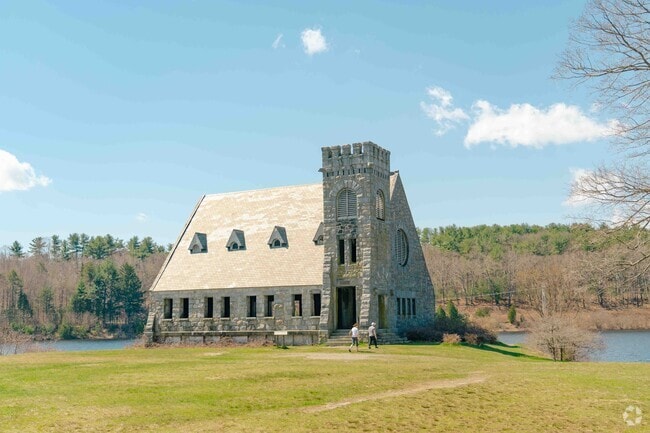 Locals walk the reservoir trail in West Boylston and admire the Old Stone Church.