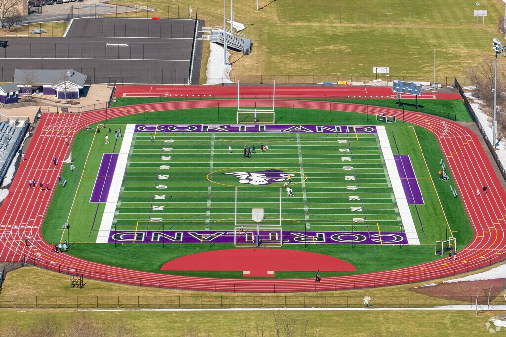 Students love to play and practice on the sports field at Cortland Junior Senior High school.