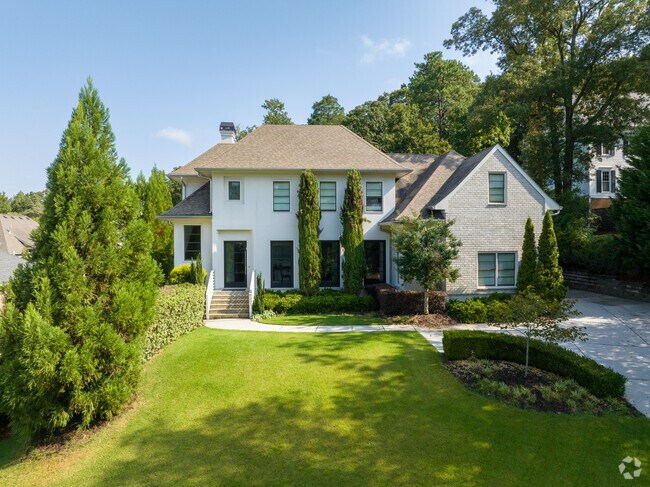 Find contemporary homes in Dunwoody Panhandle with well manicured lawns.