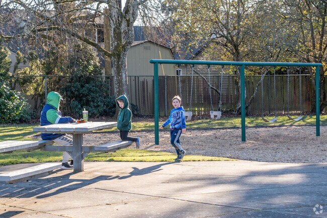 Children enjoy the playground at Oakbrook Park.