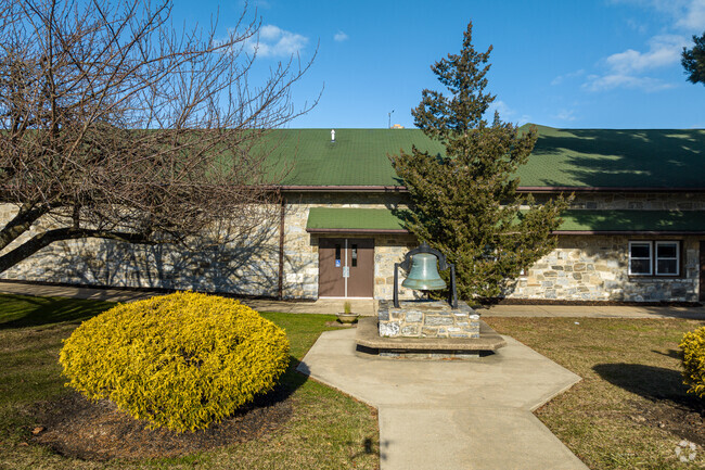 An historic bell marks the center of The Phelps School campus.