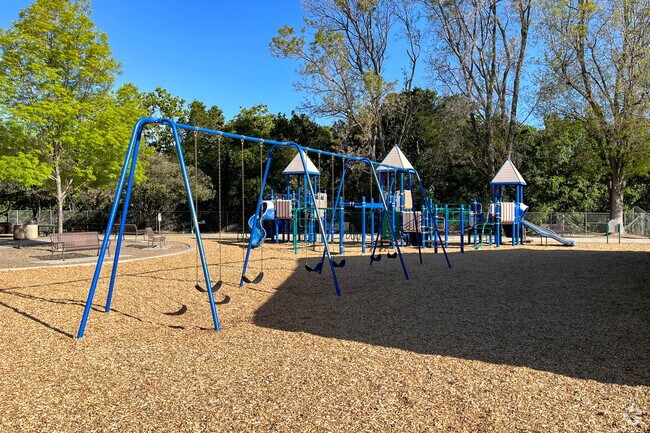 Modern playgrounds at Creekside Park in Downtown Cupertino have slides and swings for kids.