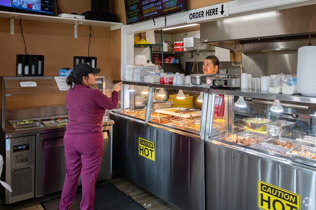 An Avenal resident orders a super burrito at Chaguitos Tacos.