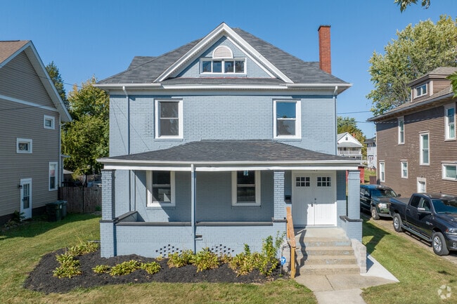 A well-maintained foursquare home stands out in McKinley Fork Northwest.