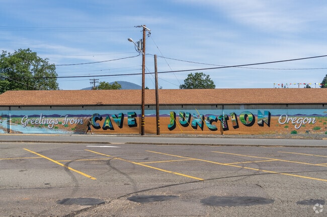 A colorful mural welcomes people to Cave Junction.