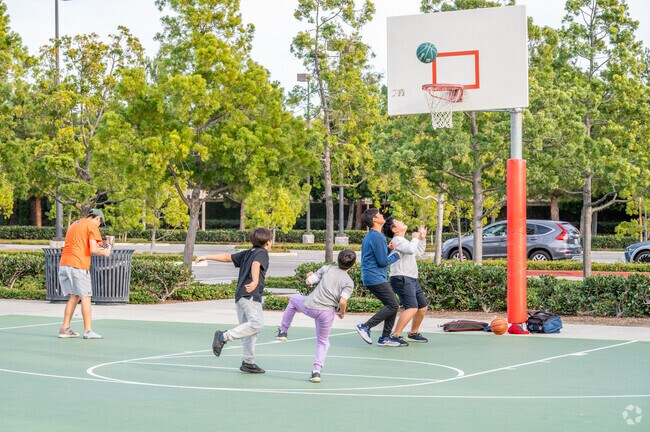 Kids can play a game of hoops at the Cypress Village Community Park.