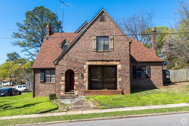 A side view of the firehouse in the neighborhood.