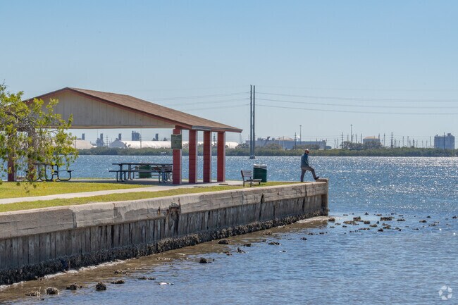 A man enjoys the view at the waterfront park in Palmetto Beach.