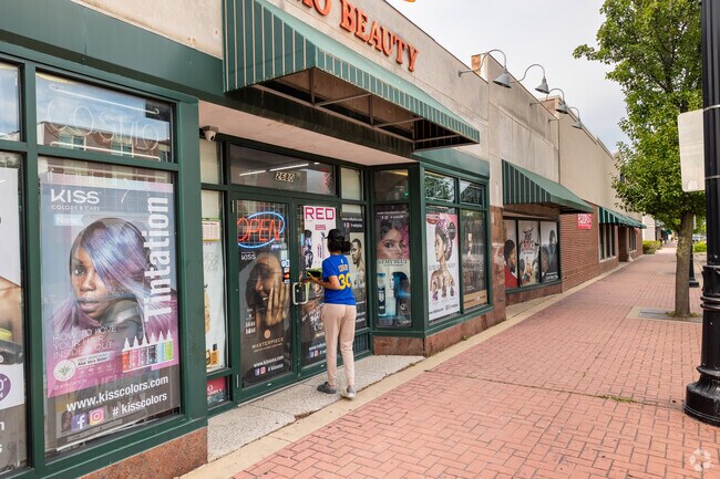 A woman enters a beauty shop in downtown Zion, IL.
