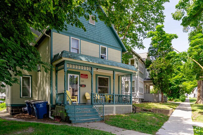 Simple victorian homes are often surrounded with lush vegetation in Germantown.