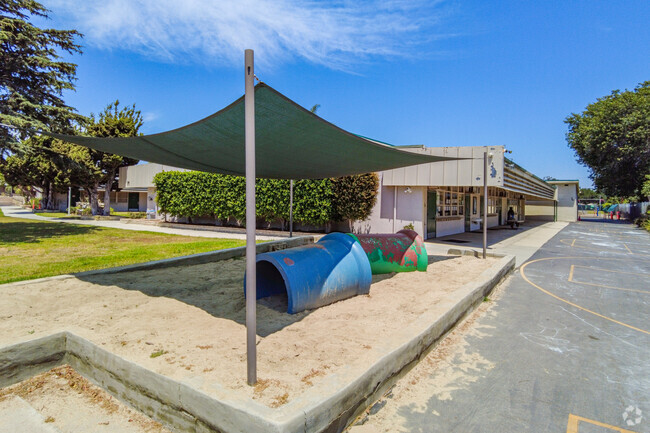 Students can make sand castles in the sand box at Orangewood Academy.