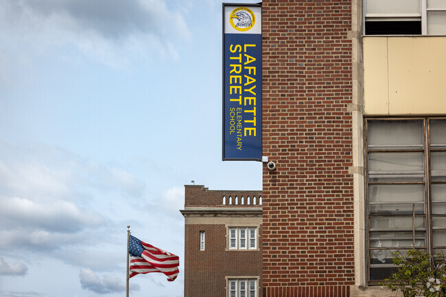 A school banner and US flag at the Lafayette Street School, Newark, NJ