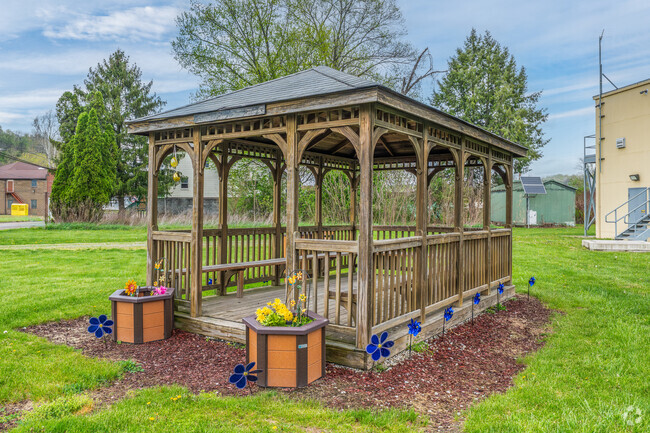 A lovely gazebo welcomes residents to spend some quiet time under its roof.