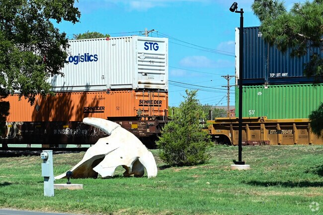 The famous bison skull sculpture sits in view as freight trains rumble through Abilene.
