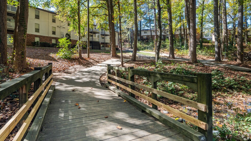 Explore the scenic walking trail perfect for a peaceful nature walk or a morning jog in the tranquility of the wooded surroundings.