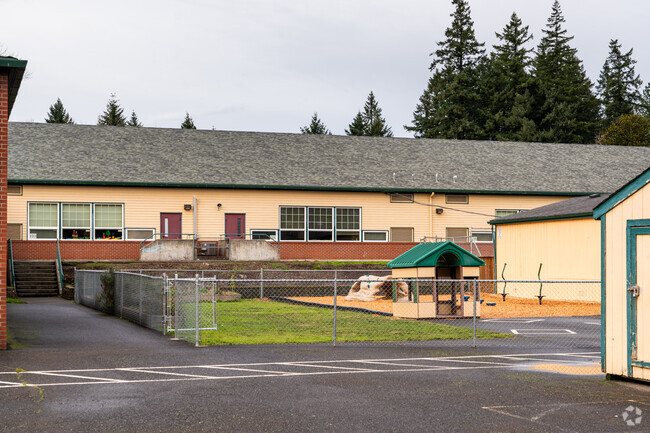 Small enclosed playground for younger children sits in the middle of Hathaway Elementary School.