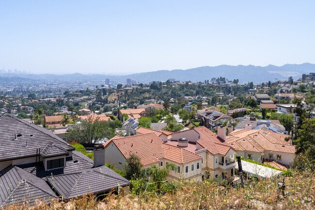 As hikers ascend Las Flores Motorway, they are rewarded with sweeping vistas of downtown Glendale nestled at the base of the Verdugo Mountains, with the Los Angeles skyline rising in the distance.